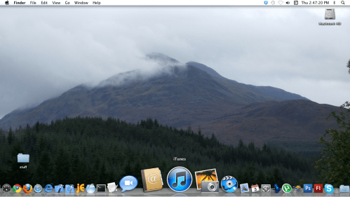 iTunes shown in Dock.