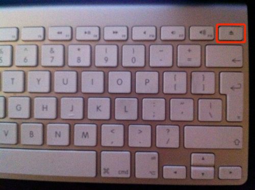 Eject key marked in red in upper right corner.